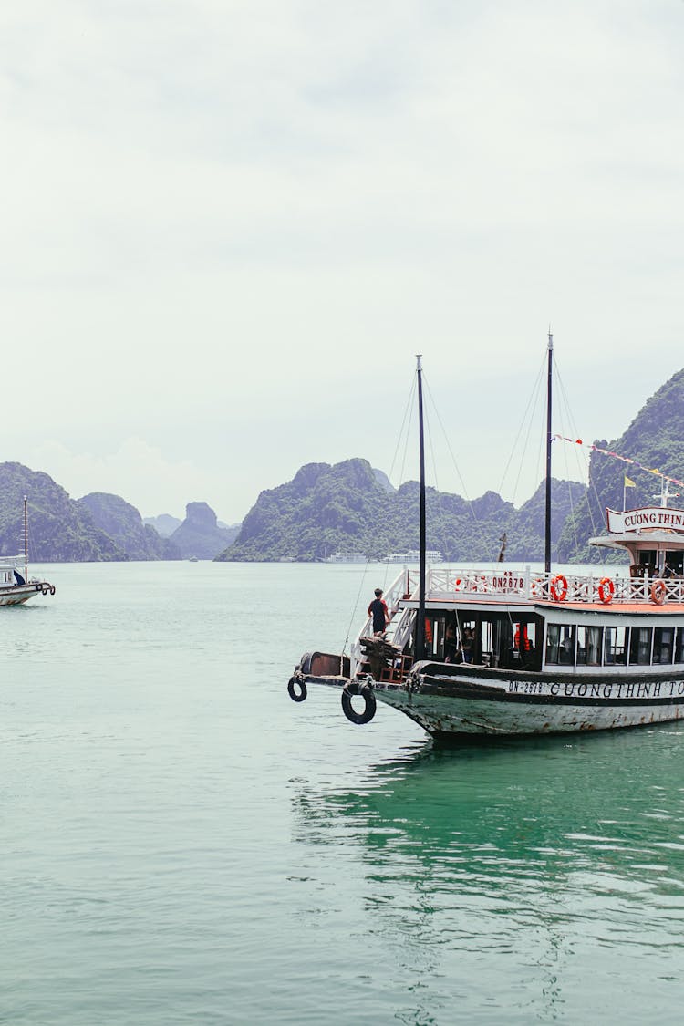 Small Boat Sailing Through Water