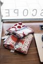 White and Red Floral Textile on Brown Wooden Table