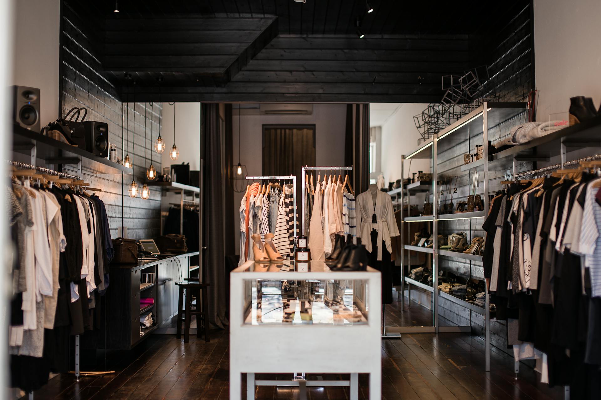 Explore the chic interior of a modern fashion retail store with clothing displays.