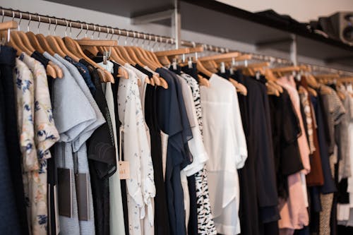 Clothes Hanging on Wooden Hangers