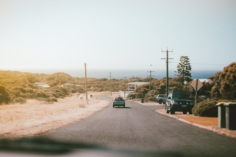 View From Inside A Car Onto A Road Down To The Beach 