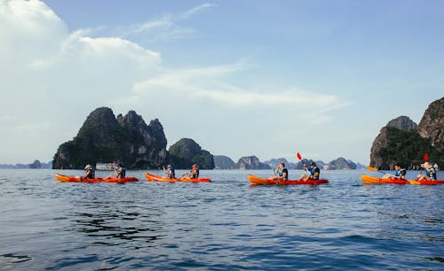 Free People Kayaking on the Sea Stock Photo