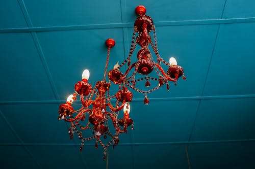 Red Chandeliers Hanging on Blue Ceiling 