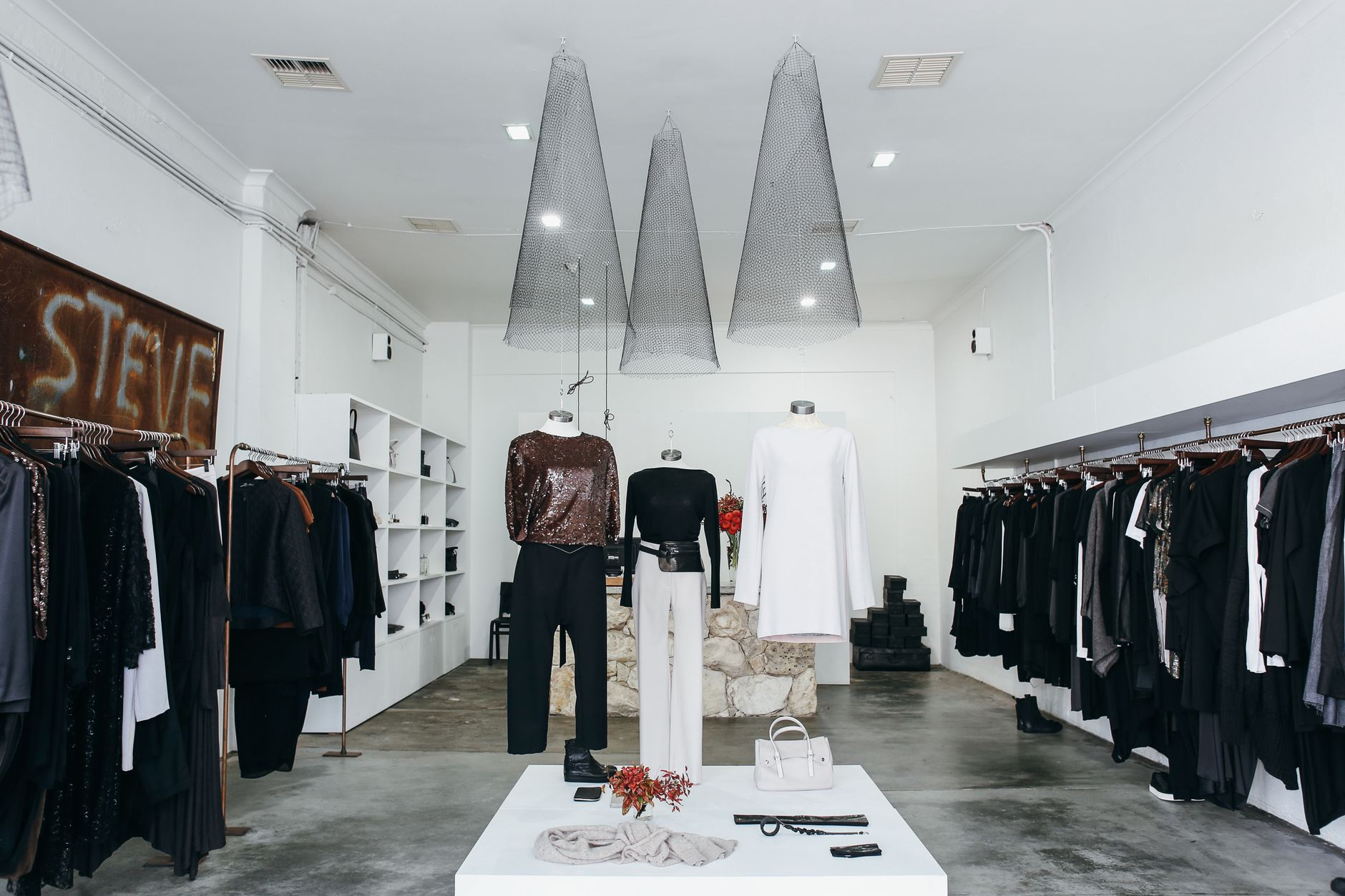 Chic boutique with elegant clothing display and stylish interior design.