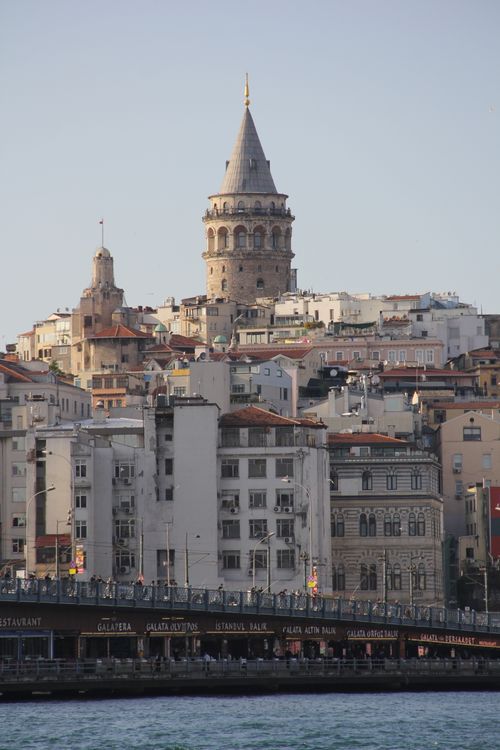 Free Historic Galata Tower rises above Istanbul's urban landscape and waterfront. Stock Photo