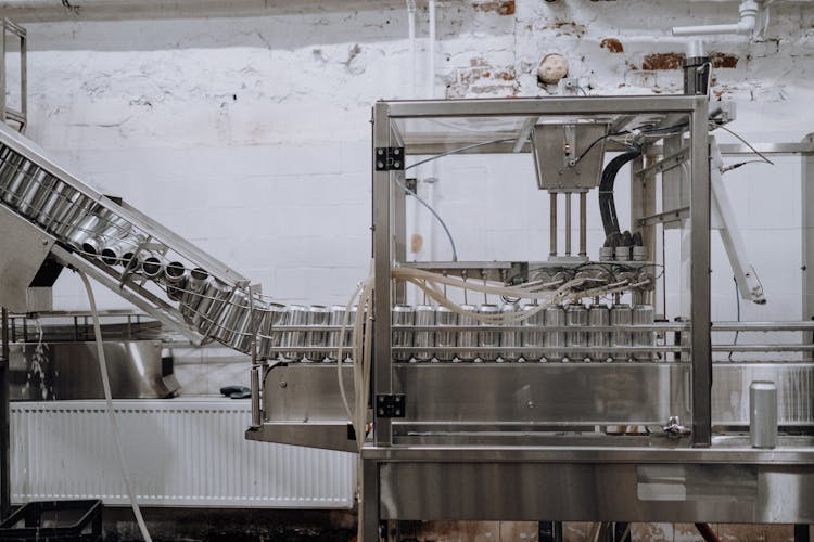 Aluminum Cans Passing Through The Assembly Line