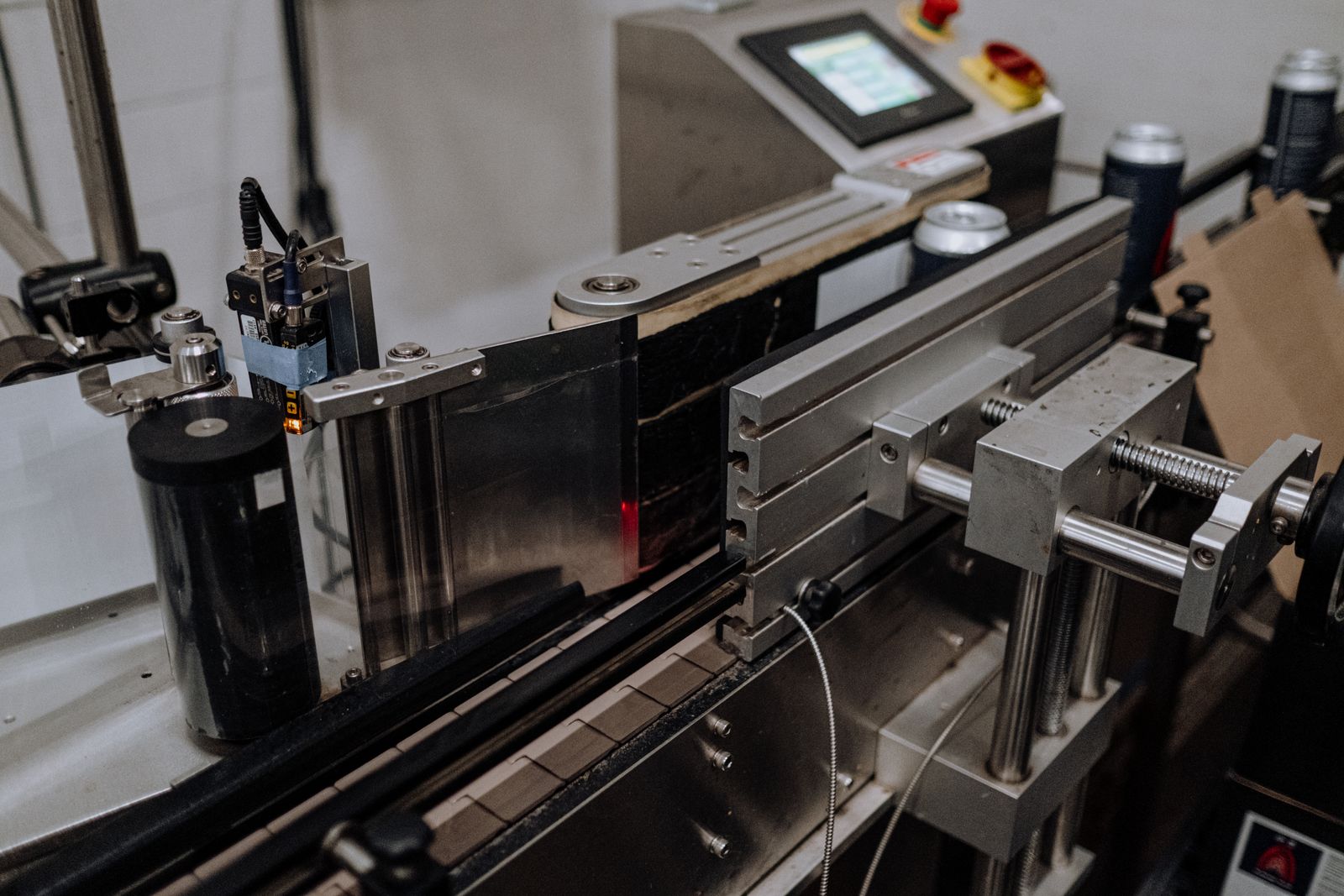 Automated canning equipment on a beverage assembly line.