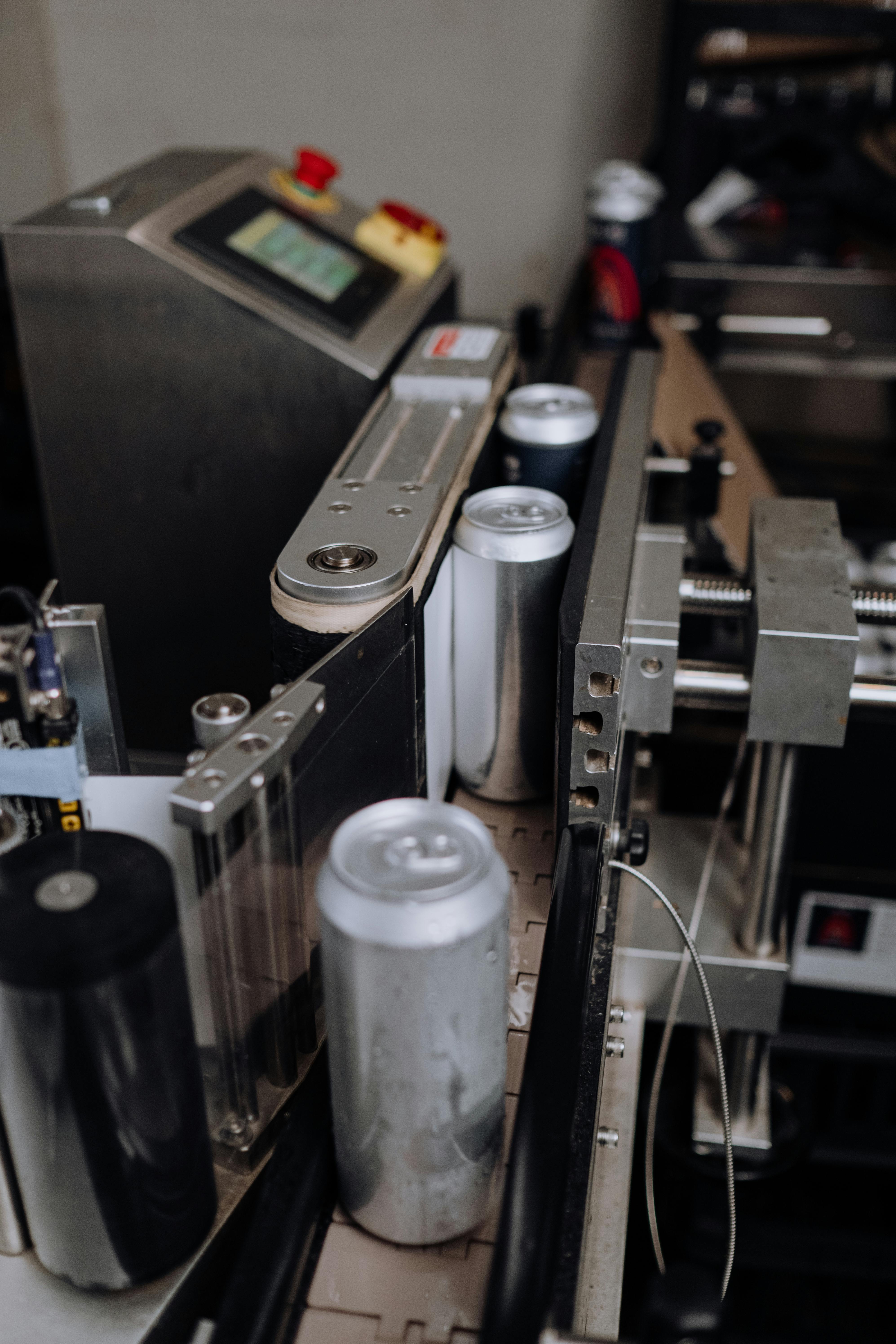 beer can passing through the computerized assembly line