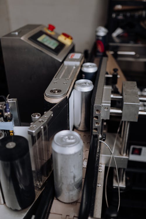 Beer Can Passing Through the Computerized Assembly Line