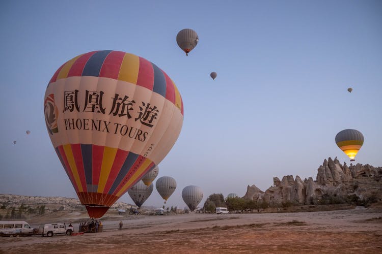 Hot Air Balloons In Desert Landscape