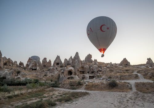 A Hot Air Balloon Flying at Sunset