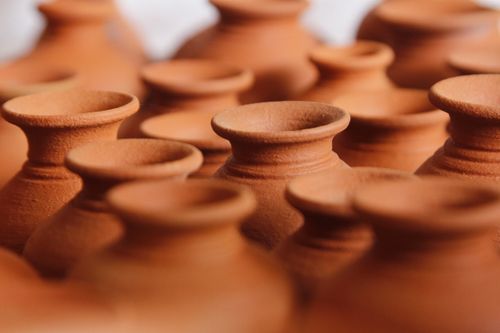 Free Detailed close-up of handcrafted earthenware clay pots arranged in rows, showcasing craftsmanship. Stock Photo