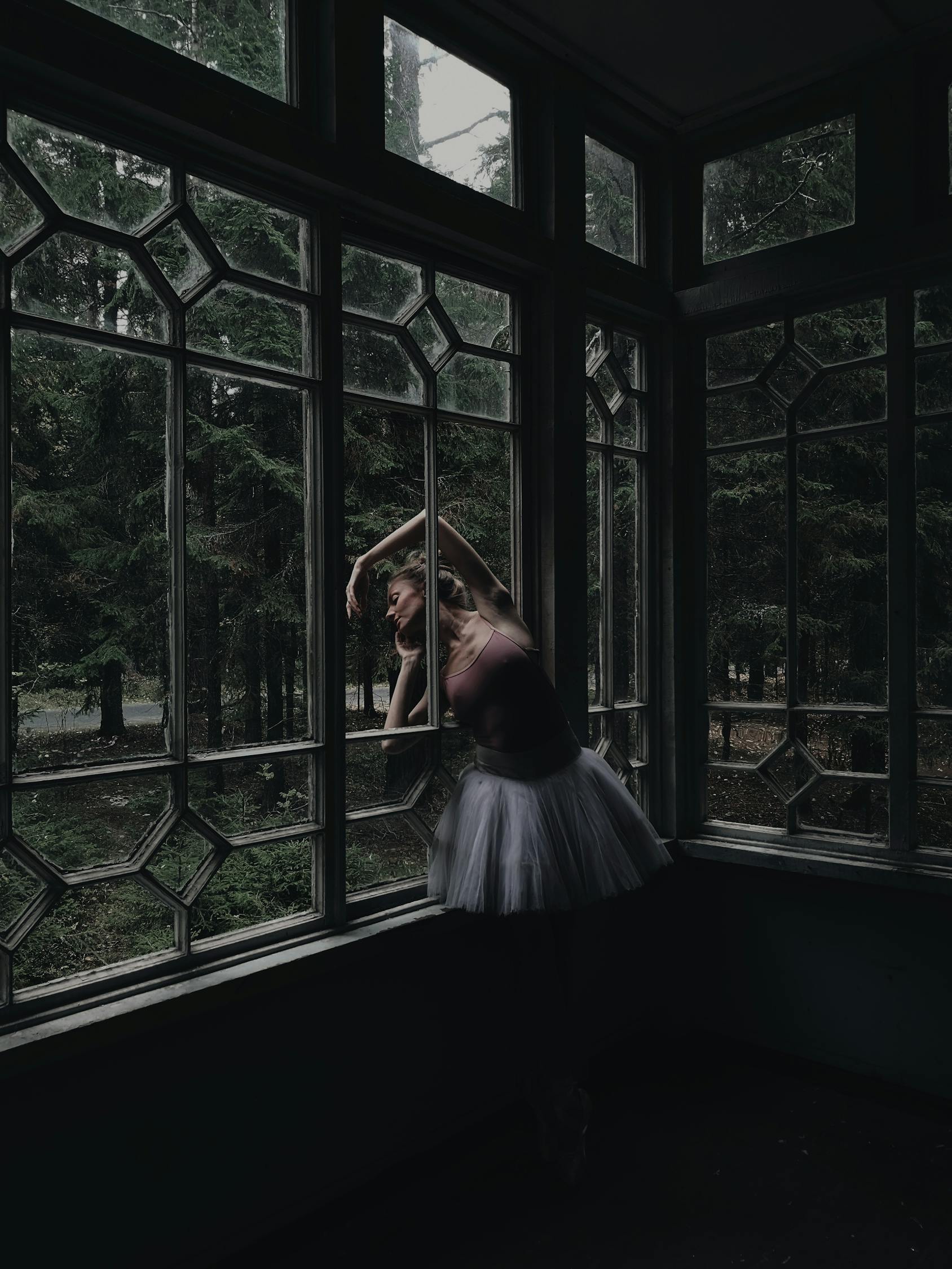 Woman in White Dress Standing Near Window