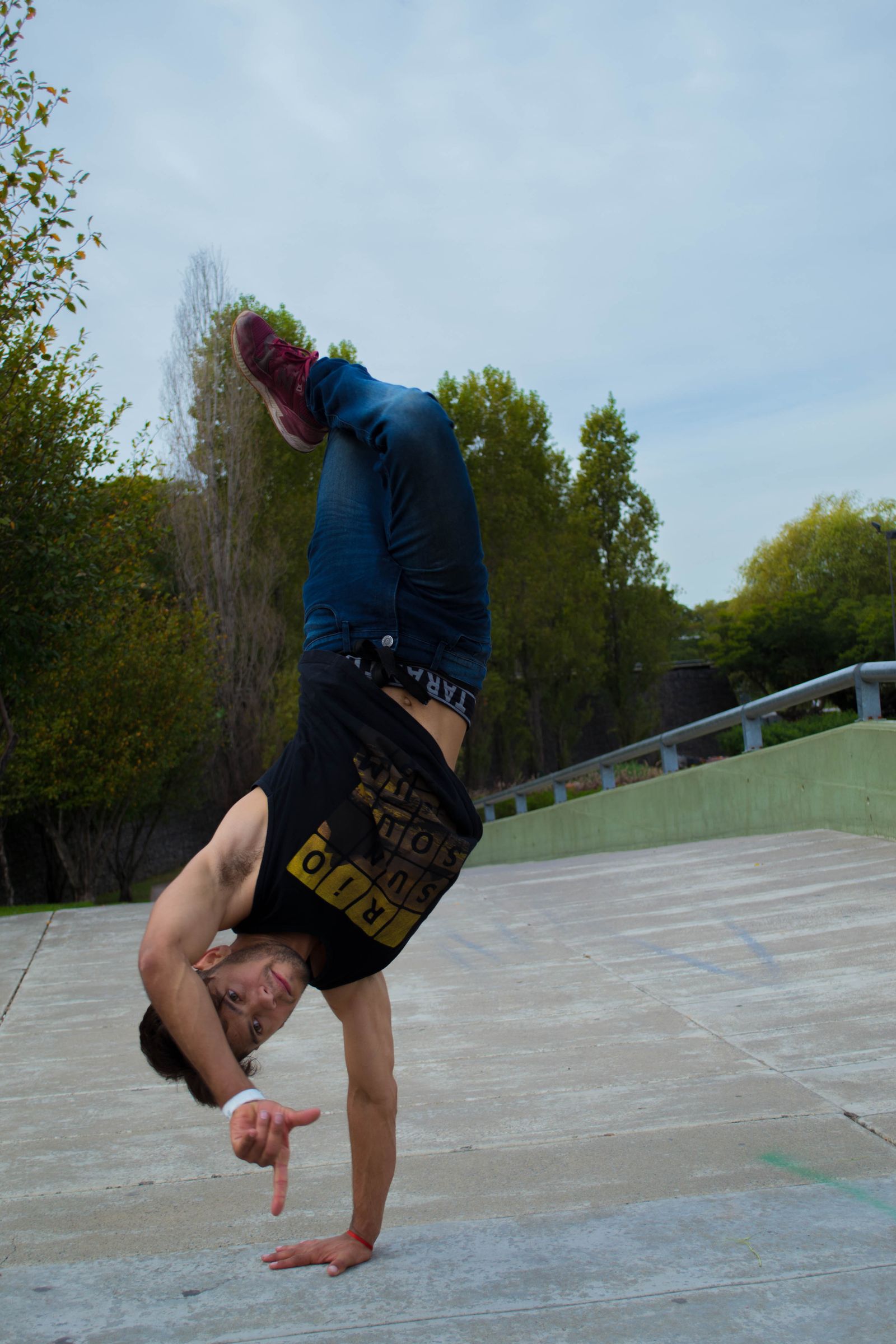 Breakdancer holding a handstand freeze on stage