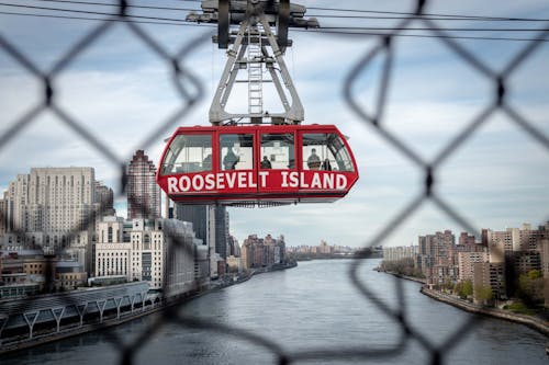 Red and White Cable Car over the River