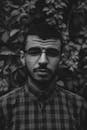 Portrait of a Man in Plaid Shirt Wearing Eyeglasses
