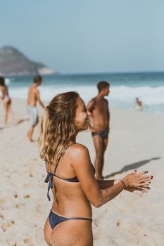 A vibrant beach scene in Brazil with people enjoying a sunny day by the sea.