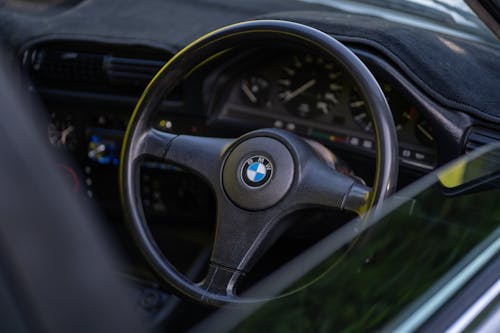 Close-Up Shot of a Black Steering Wheel