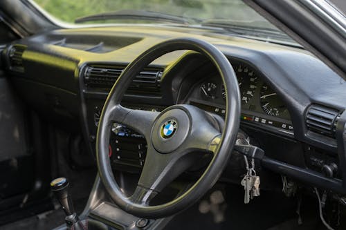 Close-Up Shot of a Black Steering Wheel