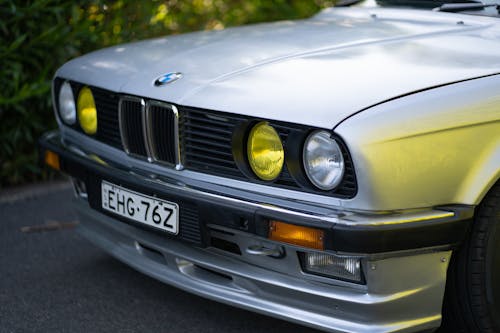 A Silver BMW Car Parked on the Road