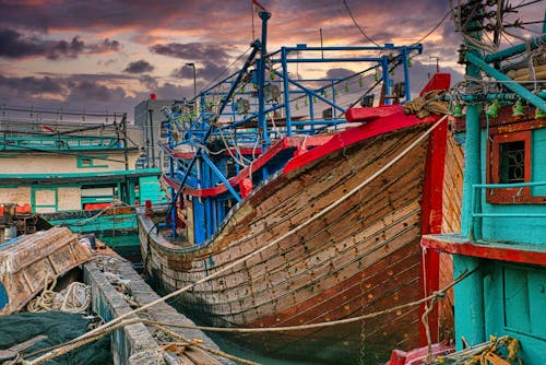 Red and Brown Boat on Dock