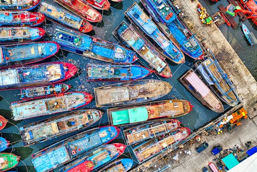 An Aerial Shot of Boats Docked on a Harbor