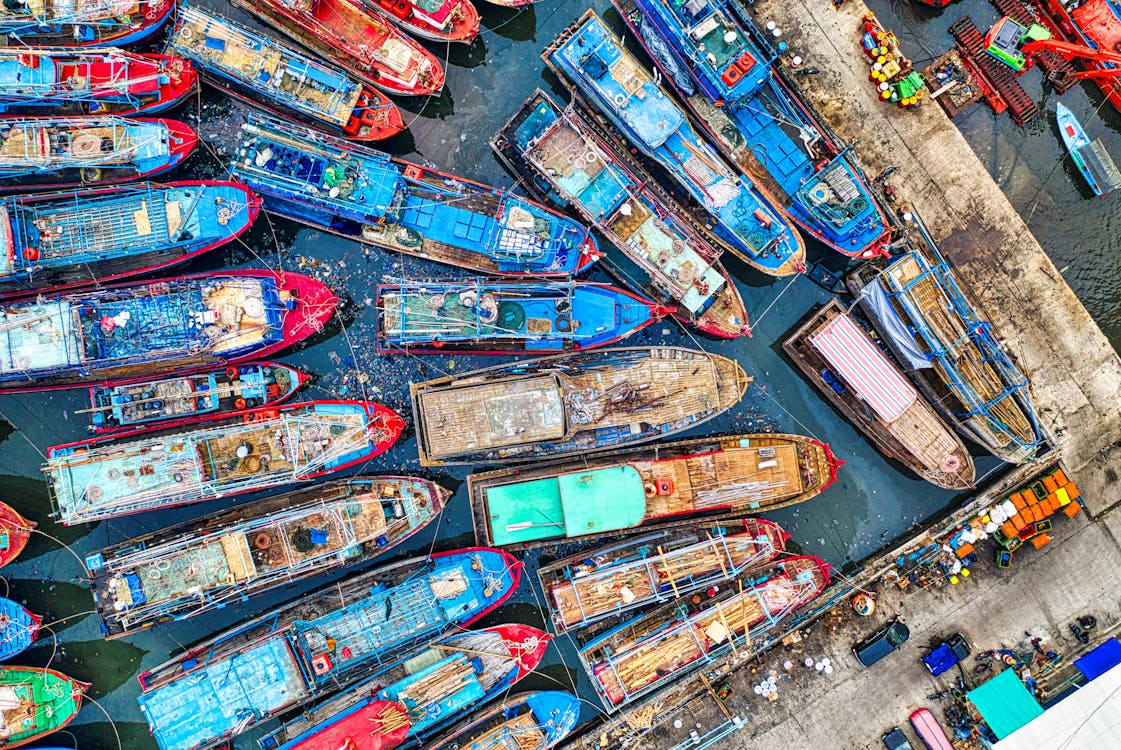 An Aerial Shot of Boats Docked on a Harbor