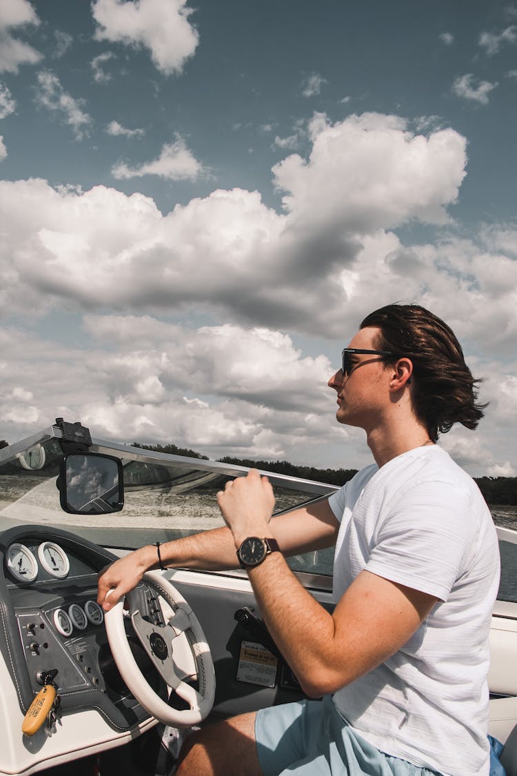 A Man Driving A Speedboat