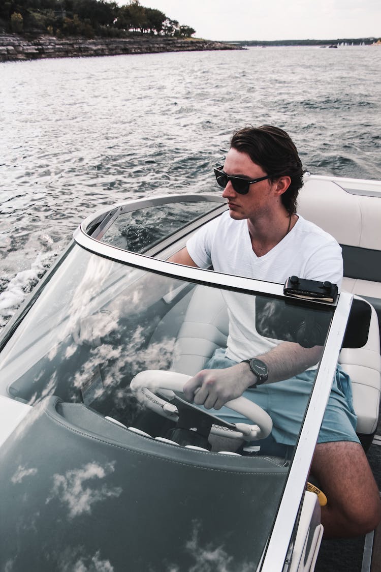 A Man Driving A Speedboat