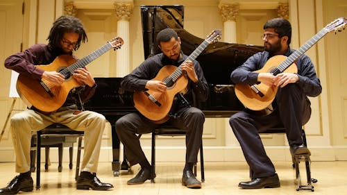 Men Playing Acoustic Guitars