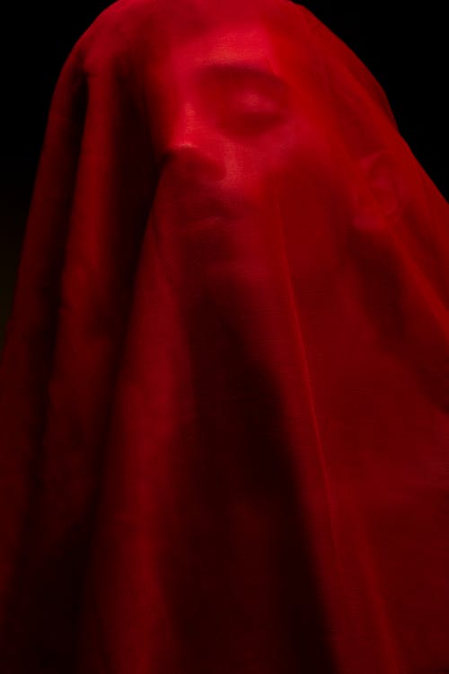 A Person Covered with Red Cloth