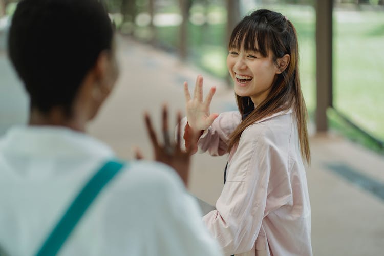 Happy Woman Waving Goodbye