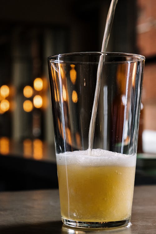 A Clear Drinking Glass With Beer