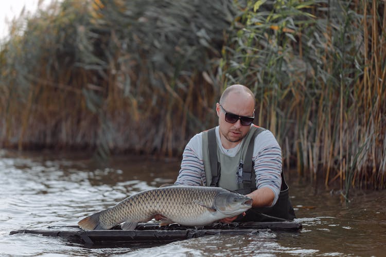 A Man Holding A Fish