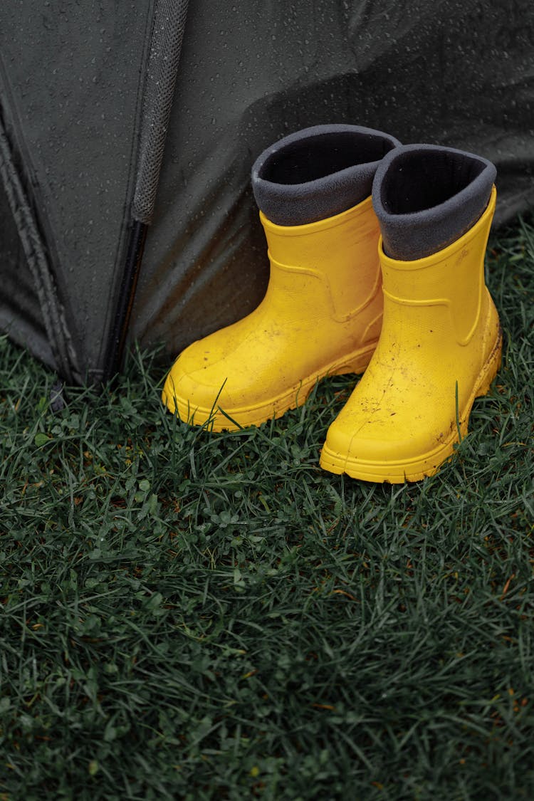 Yellow Rain Boots On The Grass