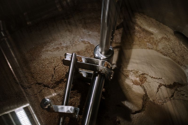 The mash mixer stirring inside the brewhouse