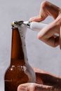 A Person Holding Brown Glass Bottle