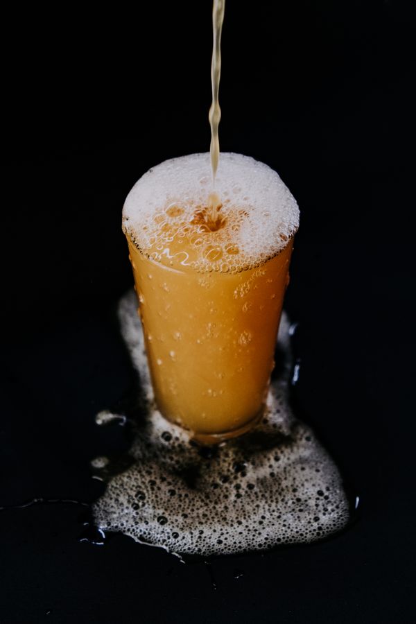 Beer pouring with a thick foamy head
