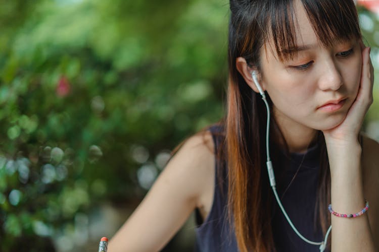 Focused Young Woman Watching Video Lecture