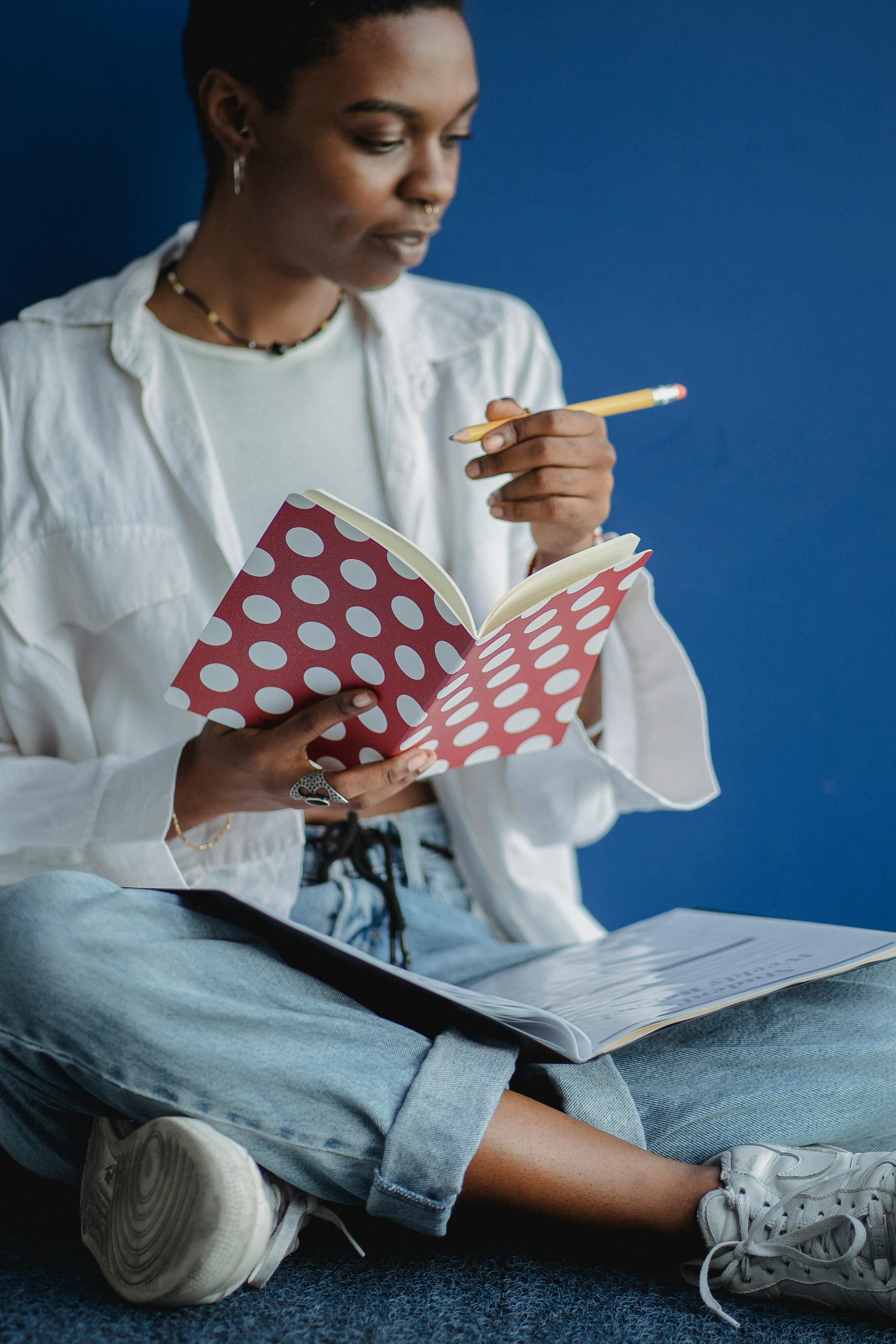 serious black student doing paperwork for studies