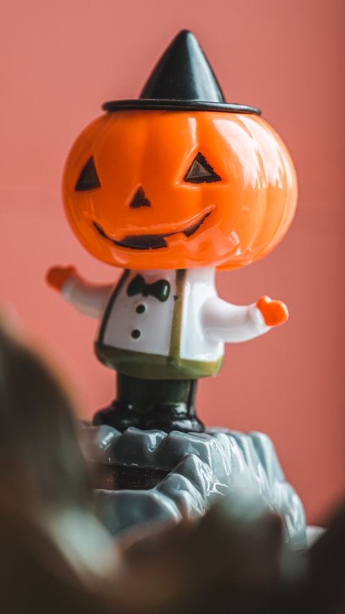 Free Close-up of a playful jack-o'-lantern toy decoration with a festive Halloween theme. Stock Photo