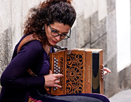 Woman Playing Accordion on the Street
