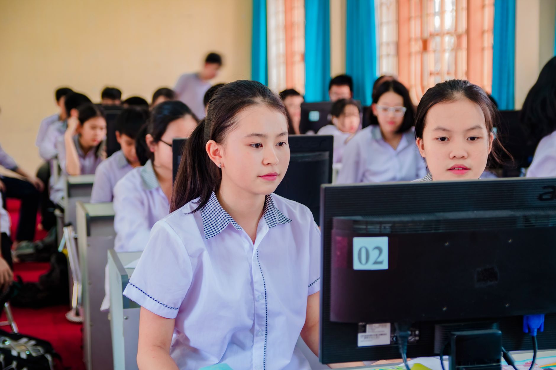 Close up of a student downloading free software on their laptop