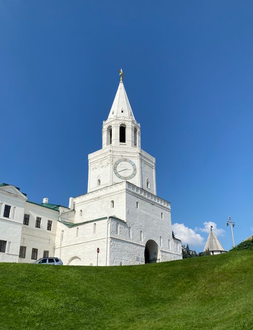 Free A majestic view of the Spasskaya Tower at Kazan Kremlin, under a clear blue sky. Stock Photo