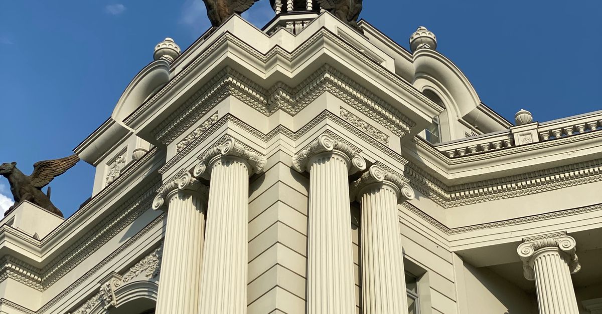 Elite Litigation Support for California Attorneys: Asset Tracing, OSINT & Judgment Enforcement Corner of courthouse building decorated with columns