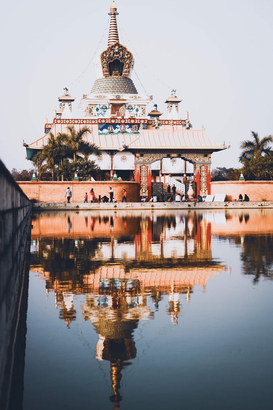 Buddhist temple reflected in a pond in Lumbini Nepal