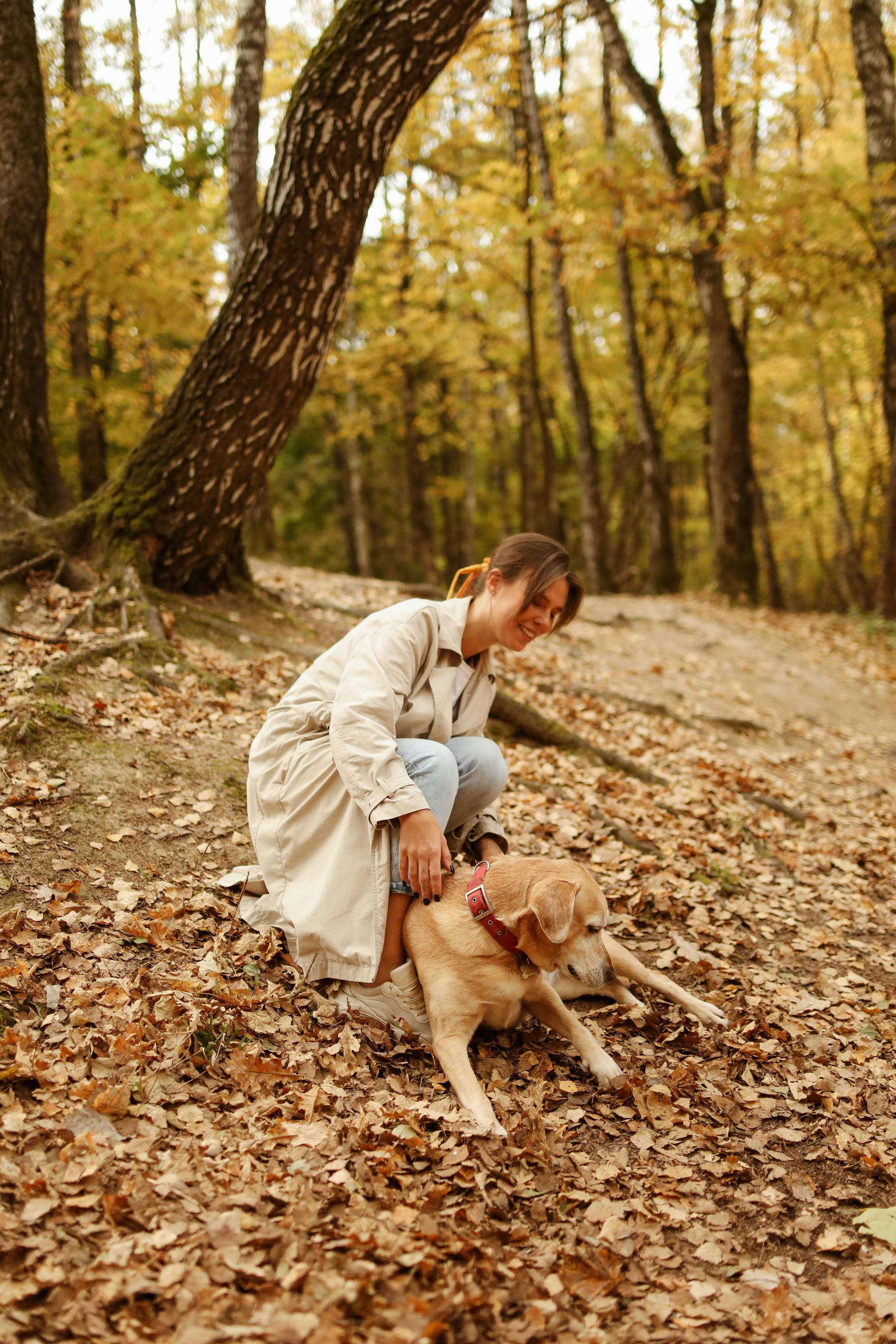 woman with her dog in the forest