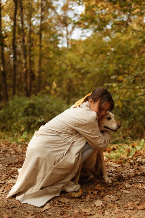 A Woman Embracing Her Dog 