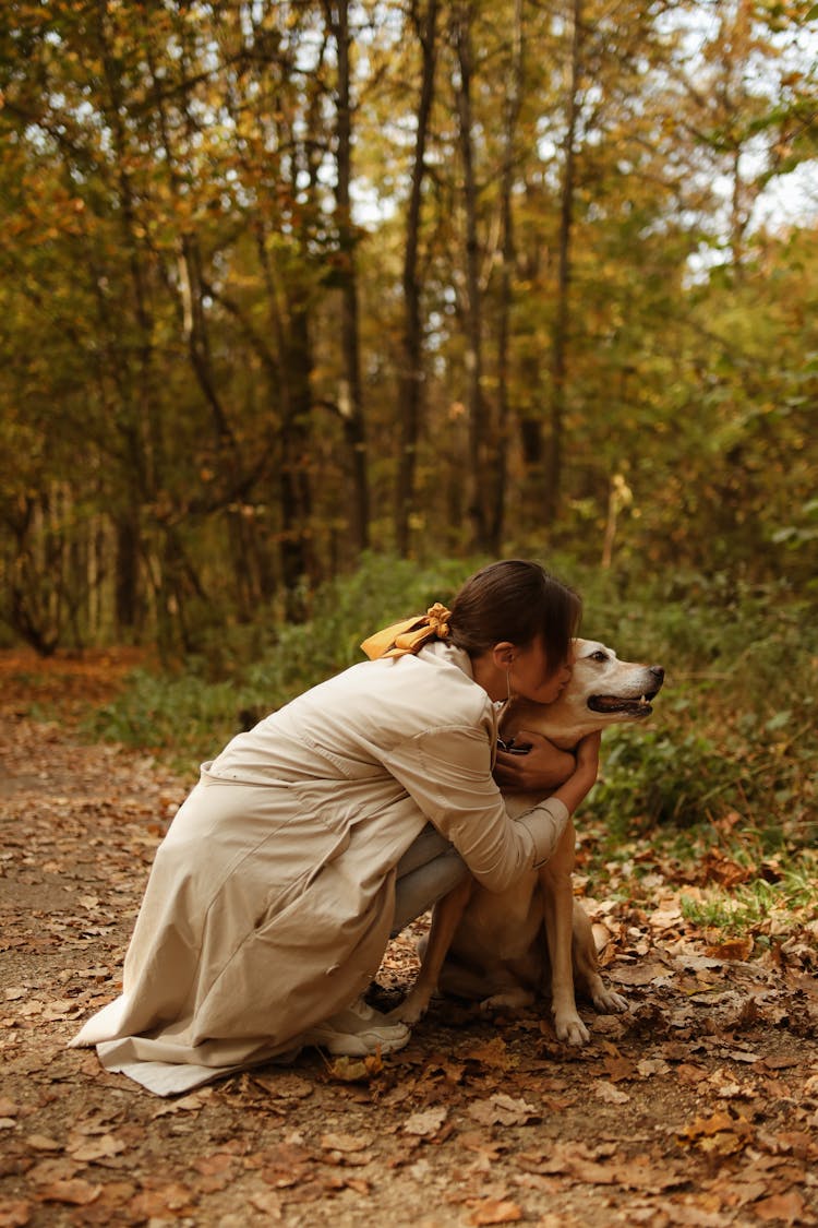 A Woman Kissing Her Dog