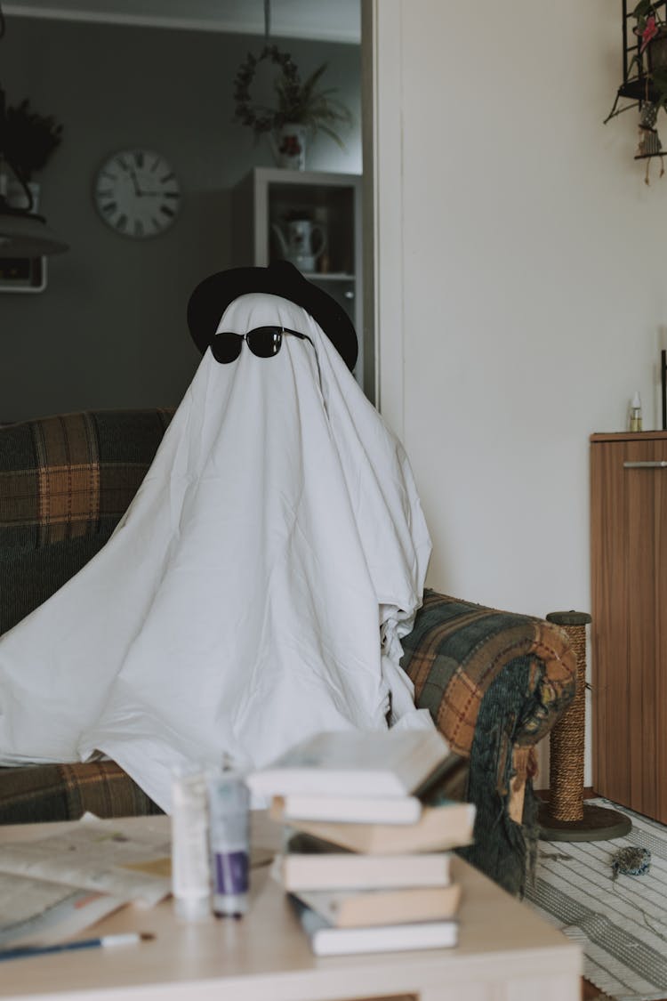 Person Wrapped In White Cloth Pretending Invisible